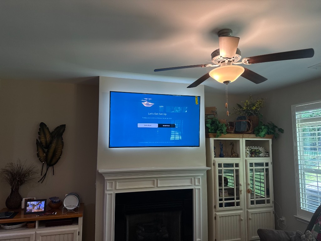 TV mounted above fireplace
